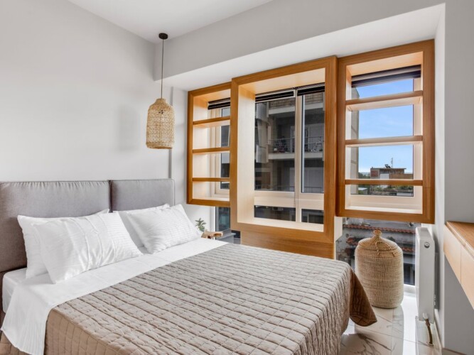 Halu! Modern and stylish bedroom interior at Verde premium apartments featuring cozy bed large windows with natural light and elegant decor for ultimate comfort and luxury living.