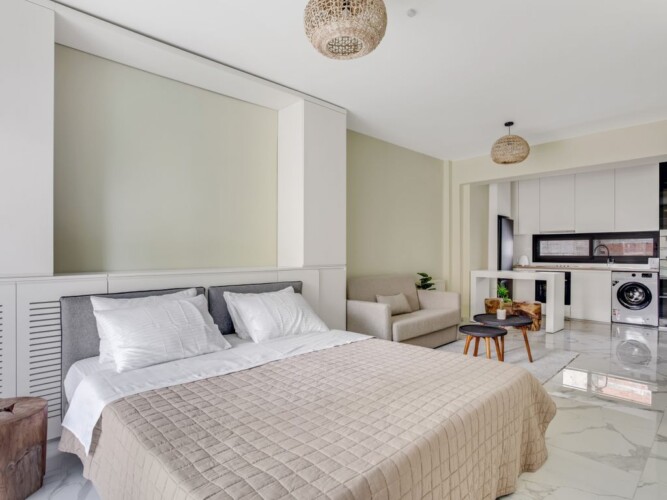 Halu! Experience modern luxury at Verde premium apartments with a spacious bedroom featuring elegant decor and natural light for sophisticated urban living.