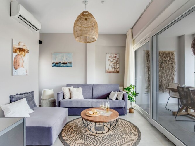 Halu! Experience luxury living at Verde Premium Apartments with this stylishly designed interior featuring modern furniture and elegant decor in a spacious living area.