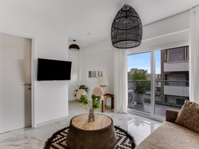 Halu! Explore the elegant interior of Verde premium apartments featuring modern decor with a cozy living area large windows and stylish furniture perfect for luxury living.