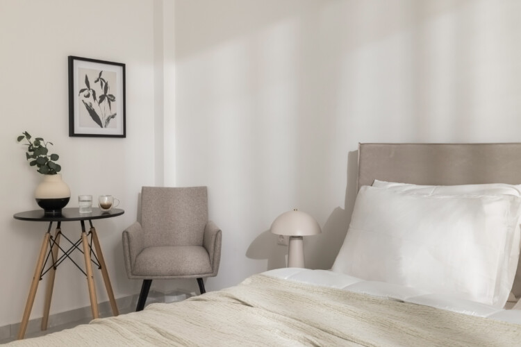 halu! Elegant bedroom at CITIZEN Thessaloniki Serviced Apartments featuring cozy 2-bedroom unit with balcony next to Nea Paralia perfect for comfortable stays