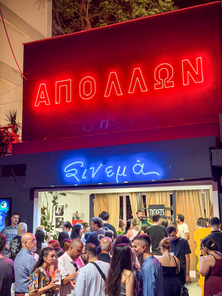 Crowds gathering outside Apollon open air cinema in Thessaloniki on a summer evening.