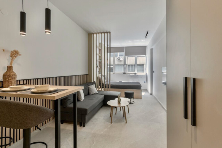 Halu! Discover the modern and stylish interior of Odyssey - Premium SKG Suites in Ladadika, offering a luxurious stay in the vibrant center with elegant decor and amenities.